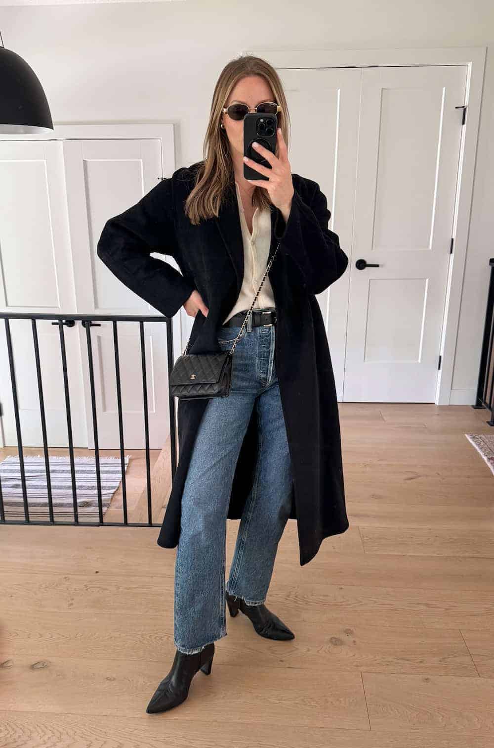 Straight Leg Jeans with a Cream Blouse and Long Black Coat Straight Leg Jeans with a Cream Blouse and Long Black Coat — Classy Boots Outfit Jeans
