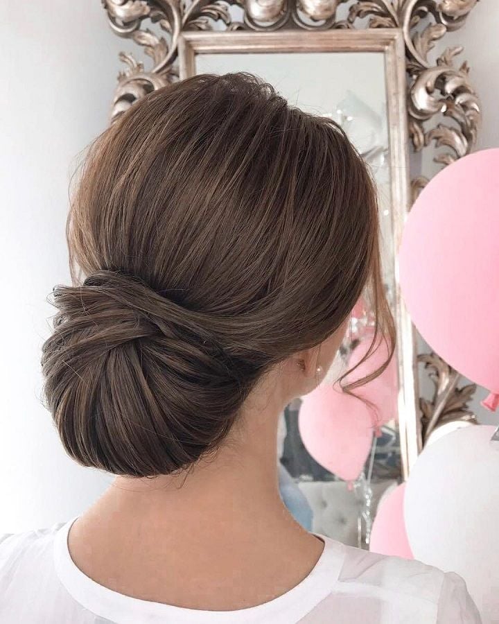 Sleek Low Bun With Subtle Highlights Sleek Low Bun With Subtle Highlights — Classy Bridal Bun
