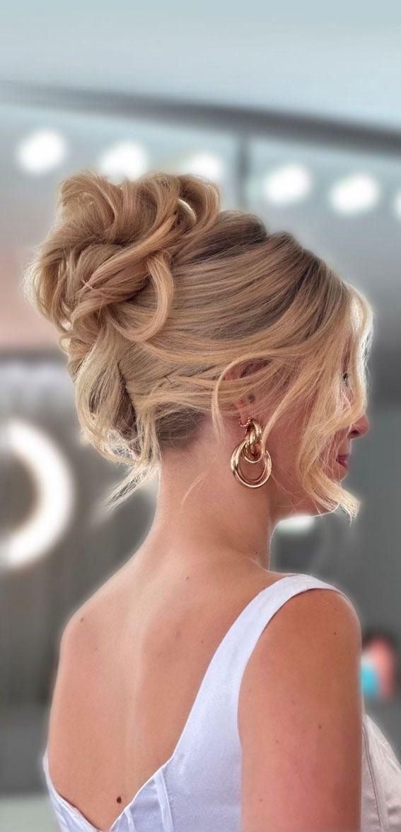 Ash Blonde Voluminous Bun With Curtain Bangs Ash Blonde Voluminous Bun With Curtain Bangs — Classy Bridal Bun