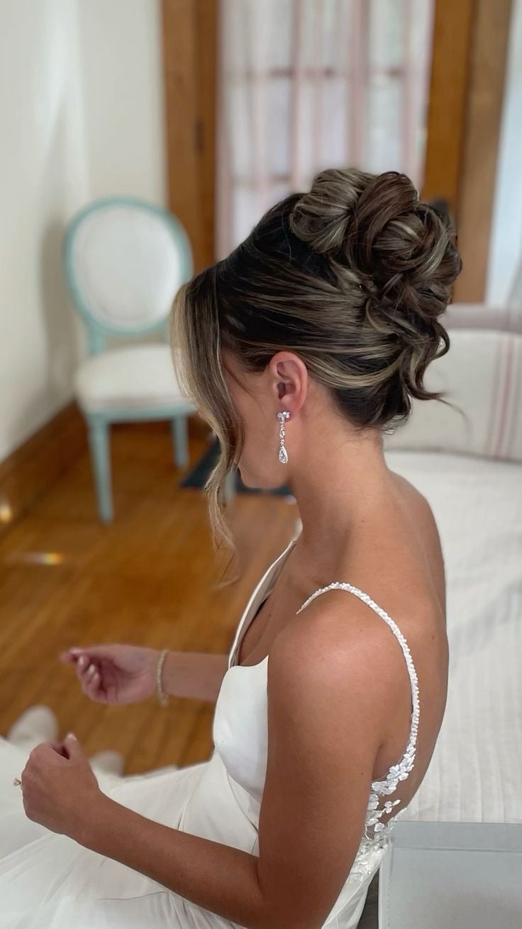 Voluminous High Bun With Wispy Bangs Voluminous High Bun With Wispy Bangs — Classy Bridal Bun