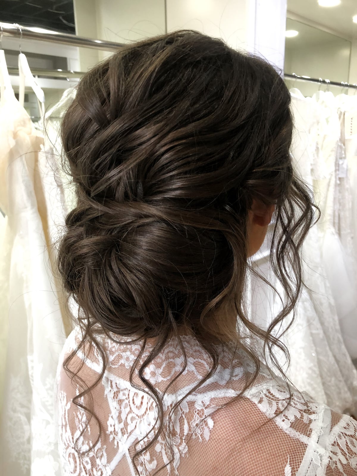 Loose Dark Brown Textured Low Bun Loose Dark Brown Textured Low Bun — Classy Bridal Bun