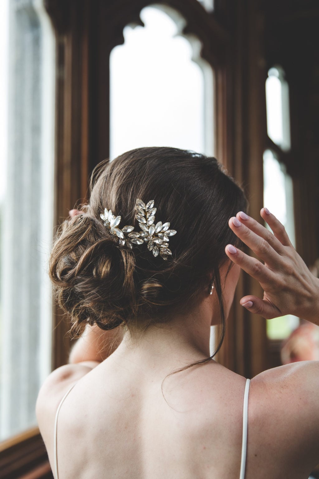 Intricate Dark Brown Twisted Low Bun Intricate Dark Brown Twisted Low Bun — Classy Bridal Bun