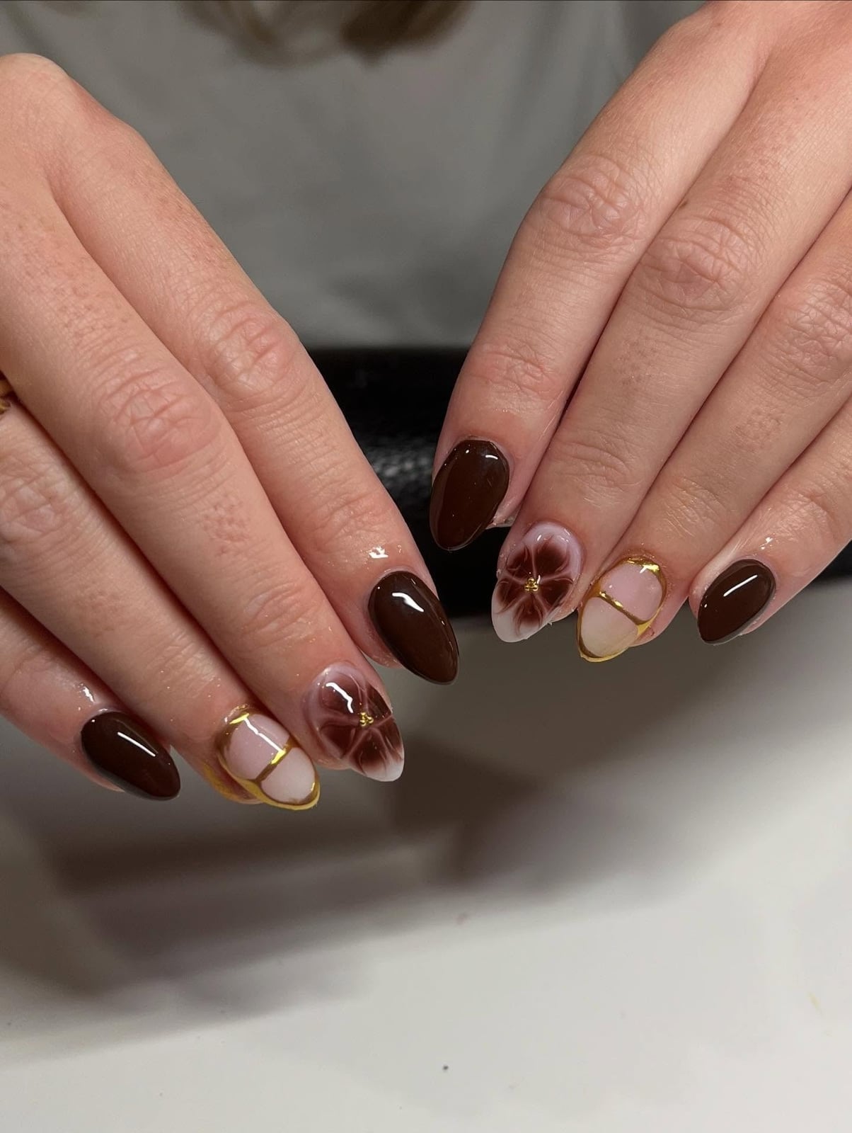 Deep Brown Floral Gold Foil Accent Almond Nails Deep Brown Floral Gold Foil Accent Almond Nails — Classy Brown Almond Nails