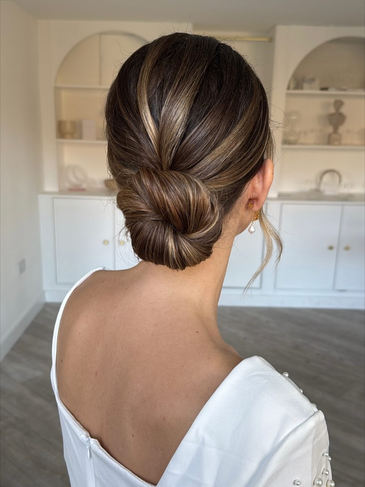Polished Low Bun With Highlights — Classy Bun and Bang