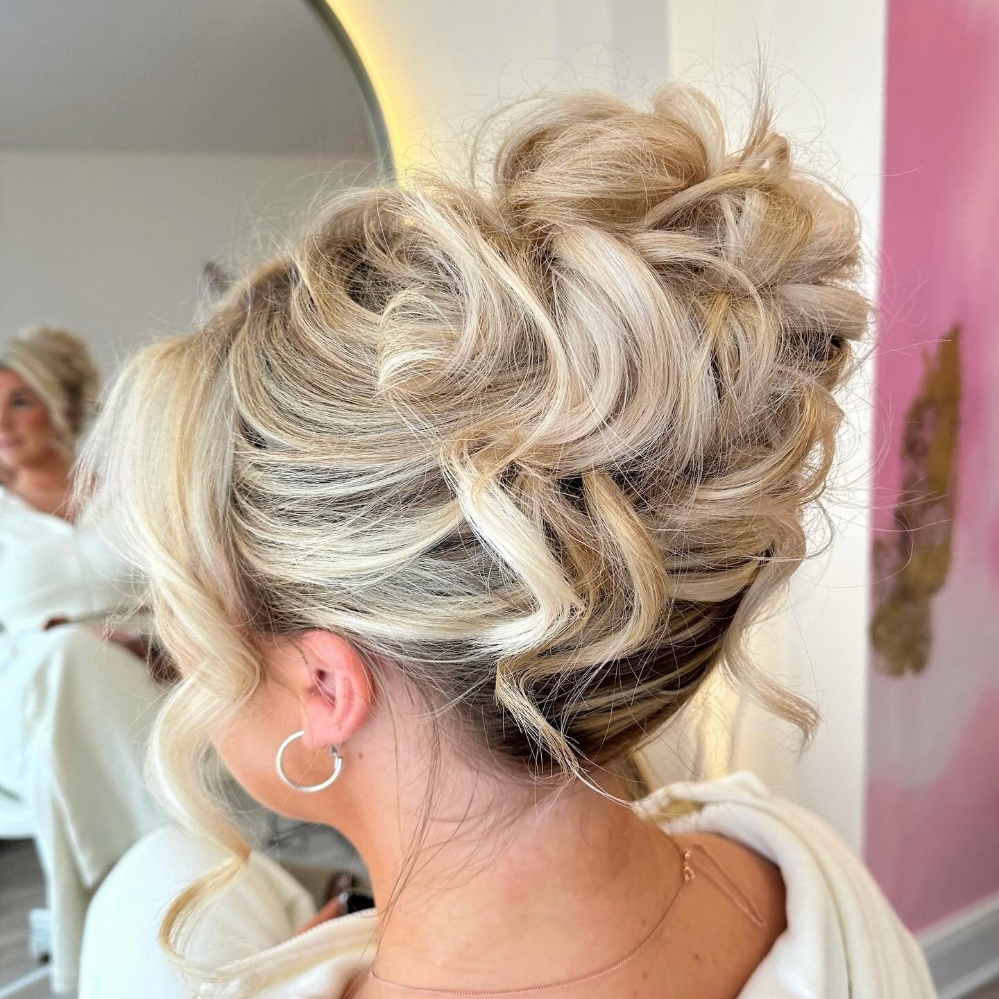 Voluminous High Bun With Loose Ash Blonde Curls Voluminous High Bun With Loose Ash Blonde Curls — Classy Casual Updo