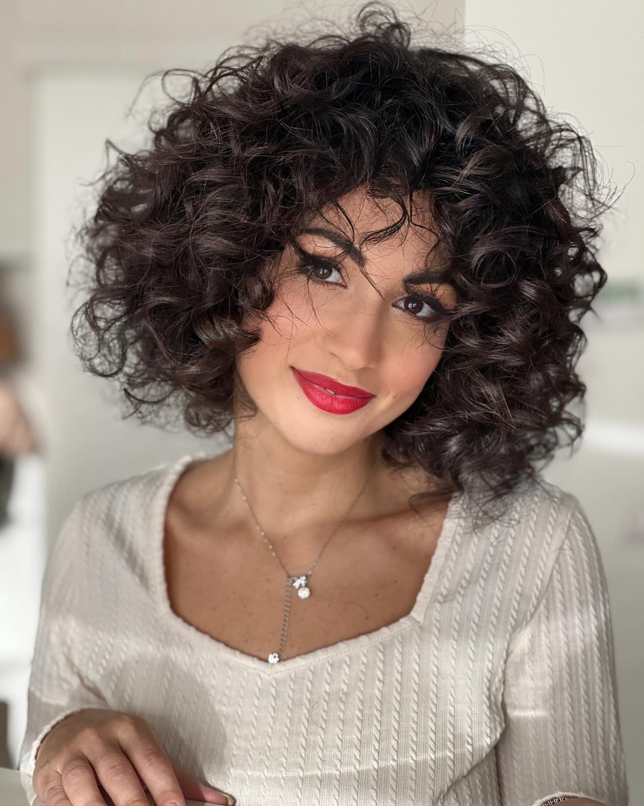 Collarbone Cut With Voluminous Curls Collarbone Cut With Voluminous Curls — Classy Curly Hair Cutting