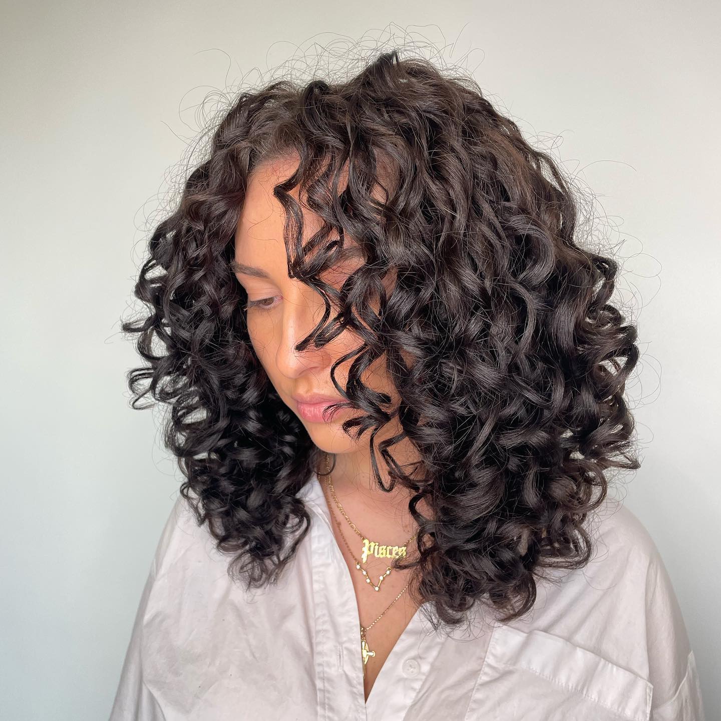Mid-Back Layers With Voluminous Curls Mid-Back Layers With Voluminous Curls — Classy Curly Hair Cutting