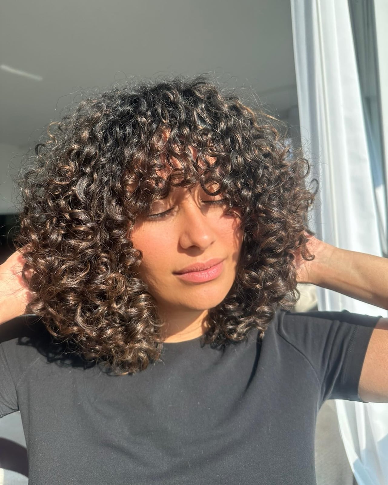 Collarbone Curls With Subtle Brown Highlights Collarbone Curls With Subtle Brown Highlights — Classy Curly Highlights