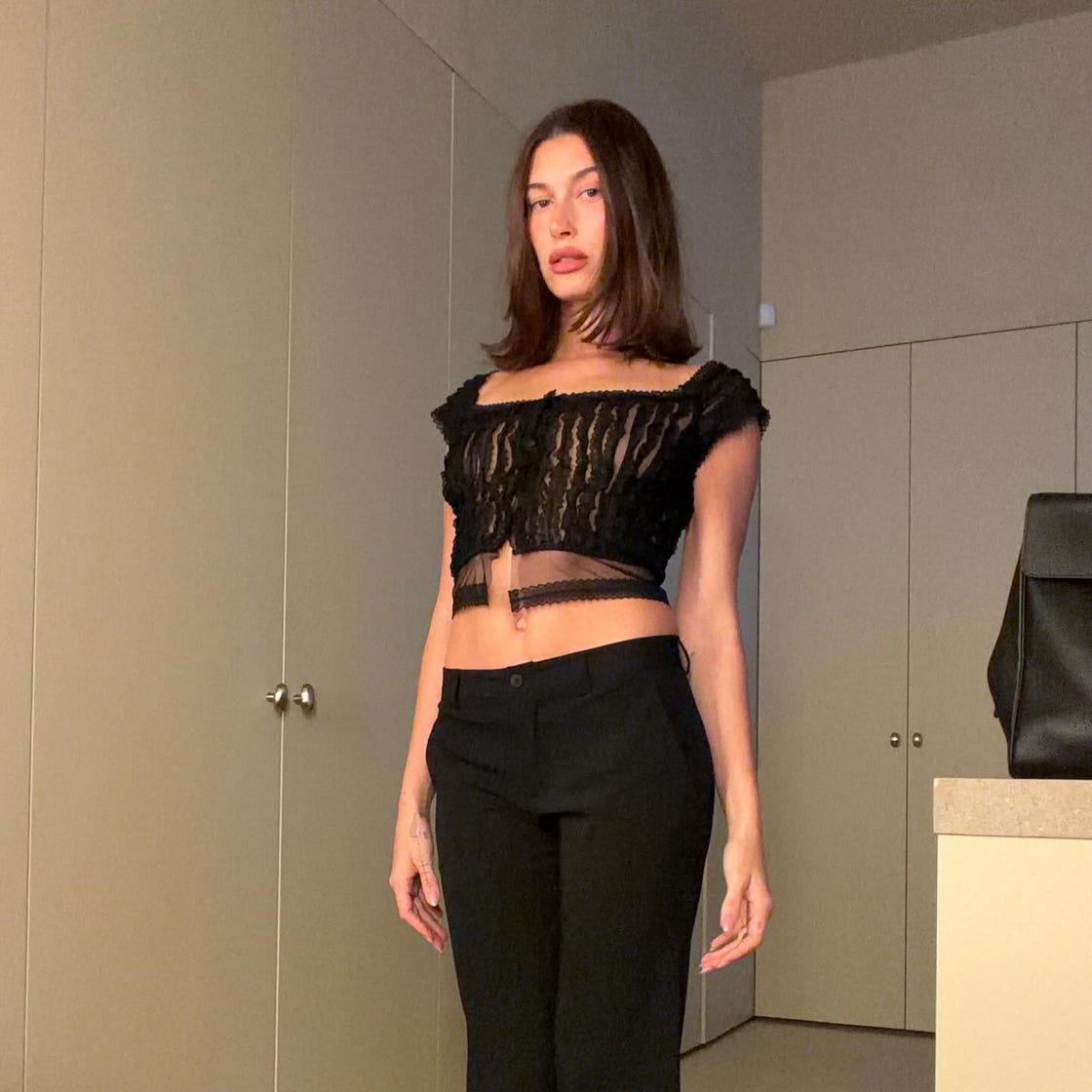 Sheer Black Lace Top with High-Waisted Trousers for a Date Sheer Black Lace Top with High-Waisted Trousers for a Date — Classy First Date Outfits