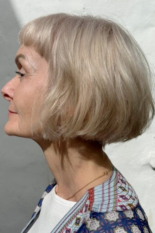 Champagne Blonde Bob With Blunt Bangs Side View — Classy French Bob