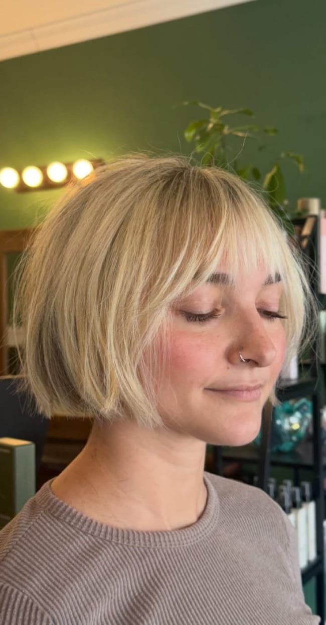 Ear-Length Ash Blonde Bob With Blunt Bangs Ear-Length Ash Blonde Bob With Blunt Bangs — Classy French Bob with Bangs