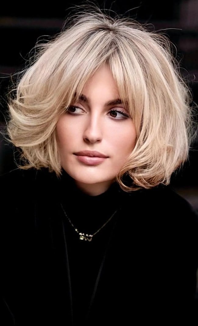Platinum Blonde Bob With Textured Curtain Bangs Platinum Blonde Bob With Textured Curtain Bangs — Classy French Bob with Bangs