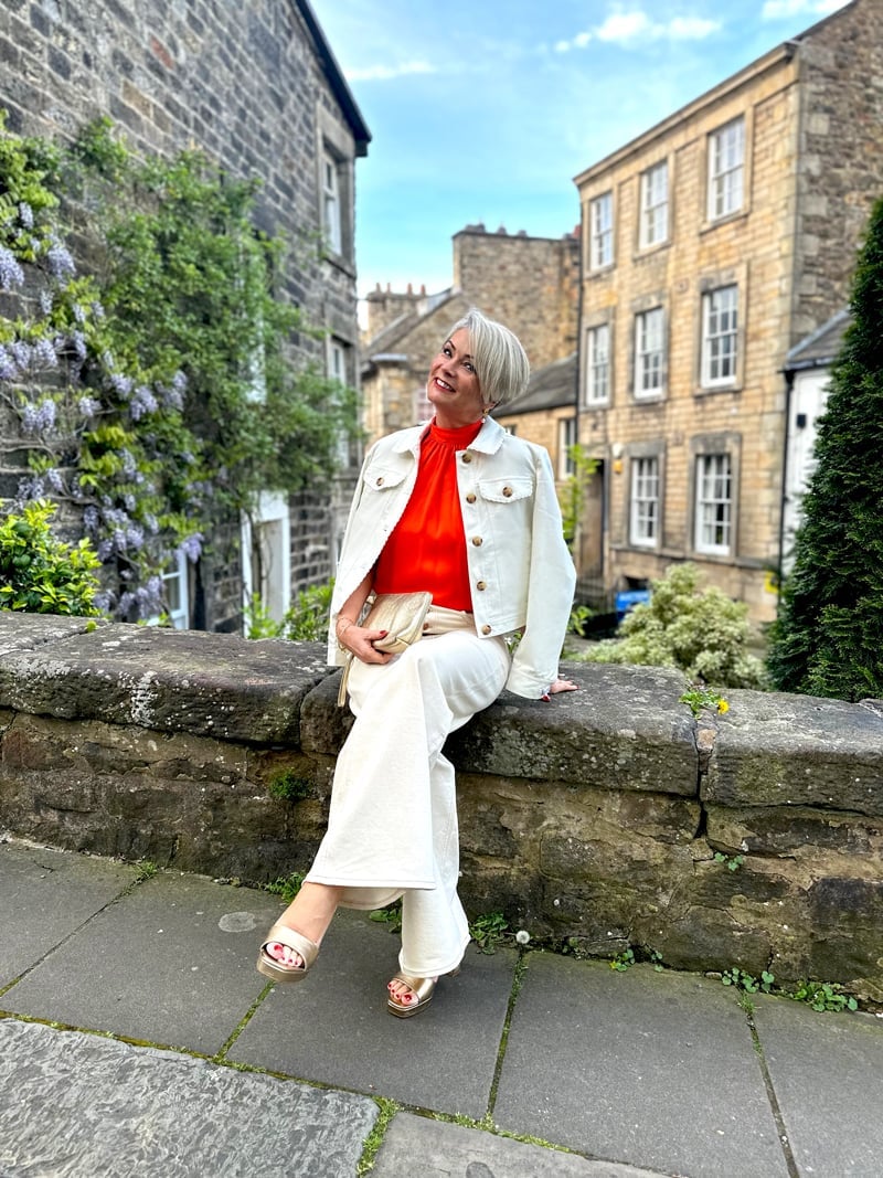 Denim Jacket Over Orange Top and White Trousers Denim Jacket Over Orange Top and White Trousers — Classy Hot Weather Outfits