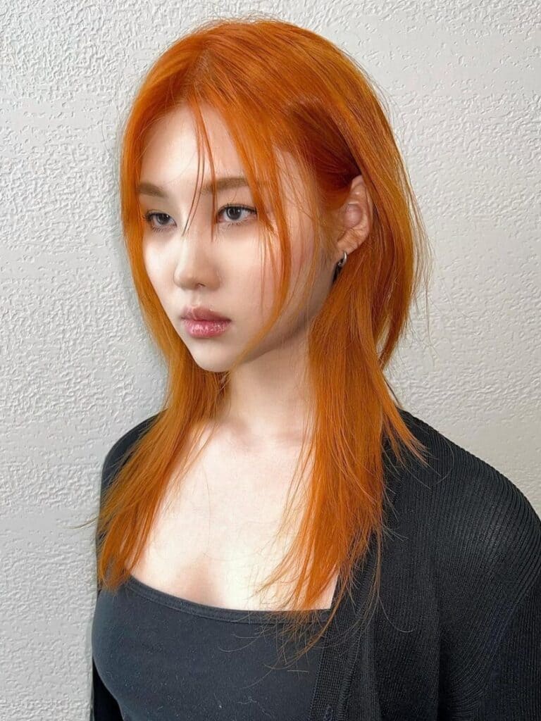 Vibrant Orange Hair With Black Cardigan And Sleeveless Top Vibrant Orange Hair With Black Cardigan And Sleeveless Top — Classy Hush Cut