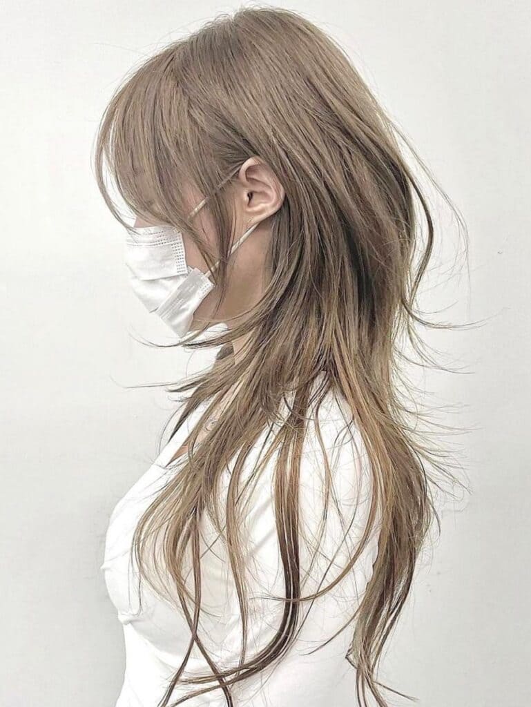 White T-Shirt Showcasing Long Wispy Layered Hair White T-Shirt Showcasing Long Wispy Layered Hair — Classy Hush Cut