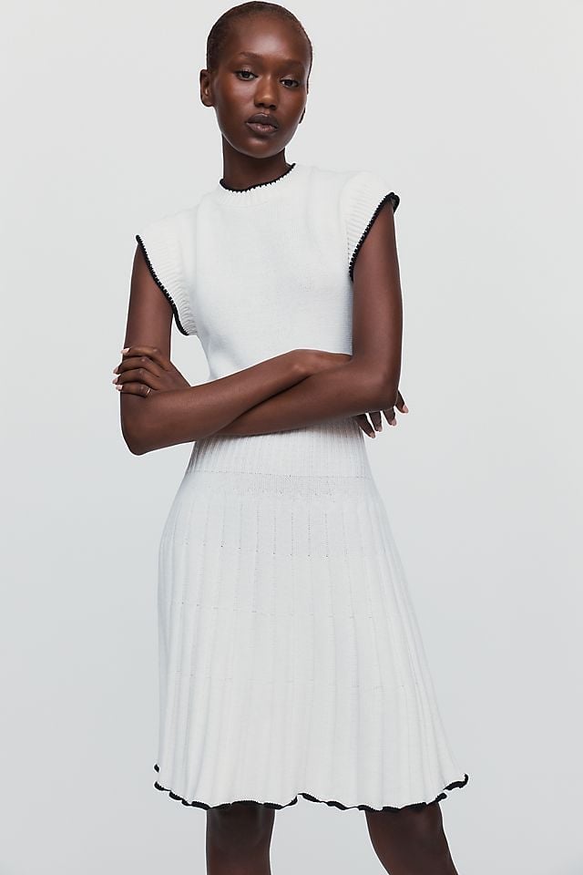 White Sleeveless Ribbed Knit Dress with Black Trim, Close-Up Take White Sleeveless Ribbed Knit Dress with Black Trim, Close-Up Take — Classy Knit Dress
