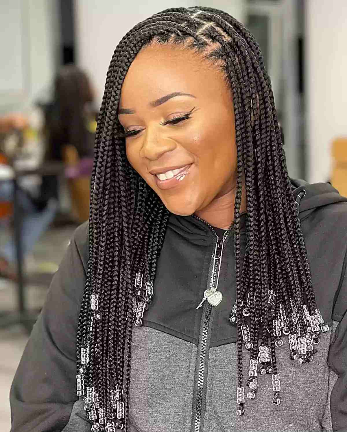 Mid-Back Black Knotless Braids With Silver Beads Mid-Back Black Knotless Braids With Silver Beads — Classy Knotless Hairstyles