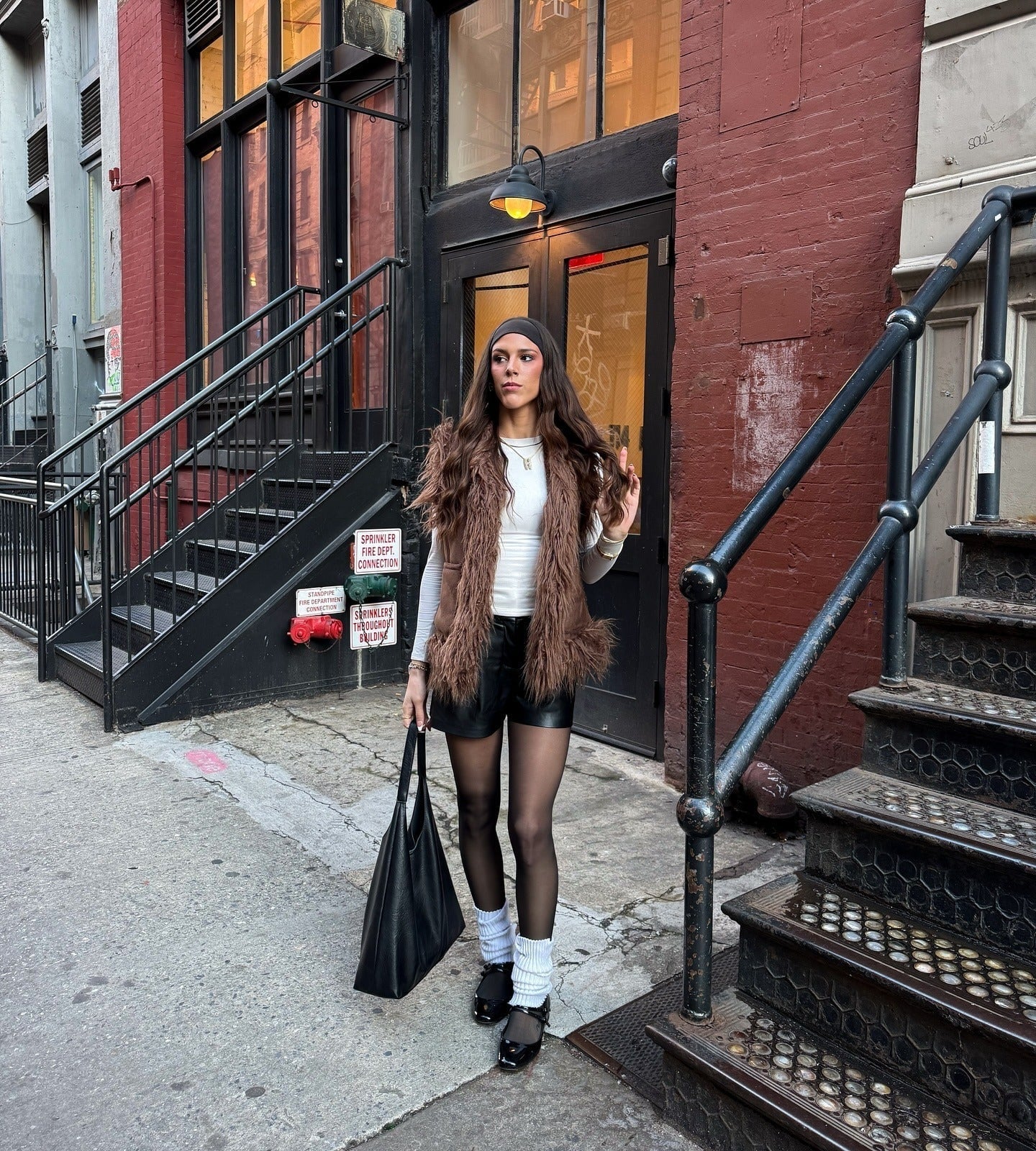 Brown Faux Fur Vest with Leather Shorts and White Leg Warmers — Classy Leg Warmers Outfits