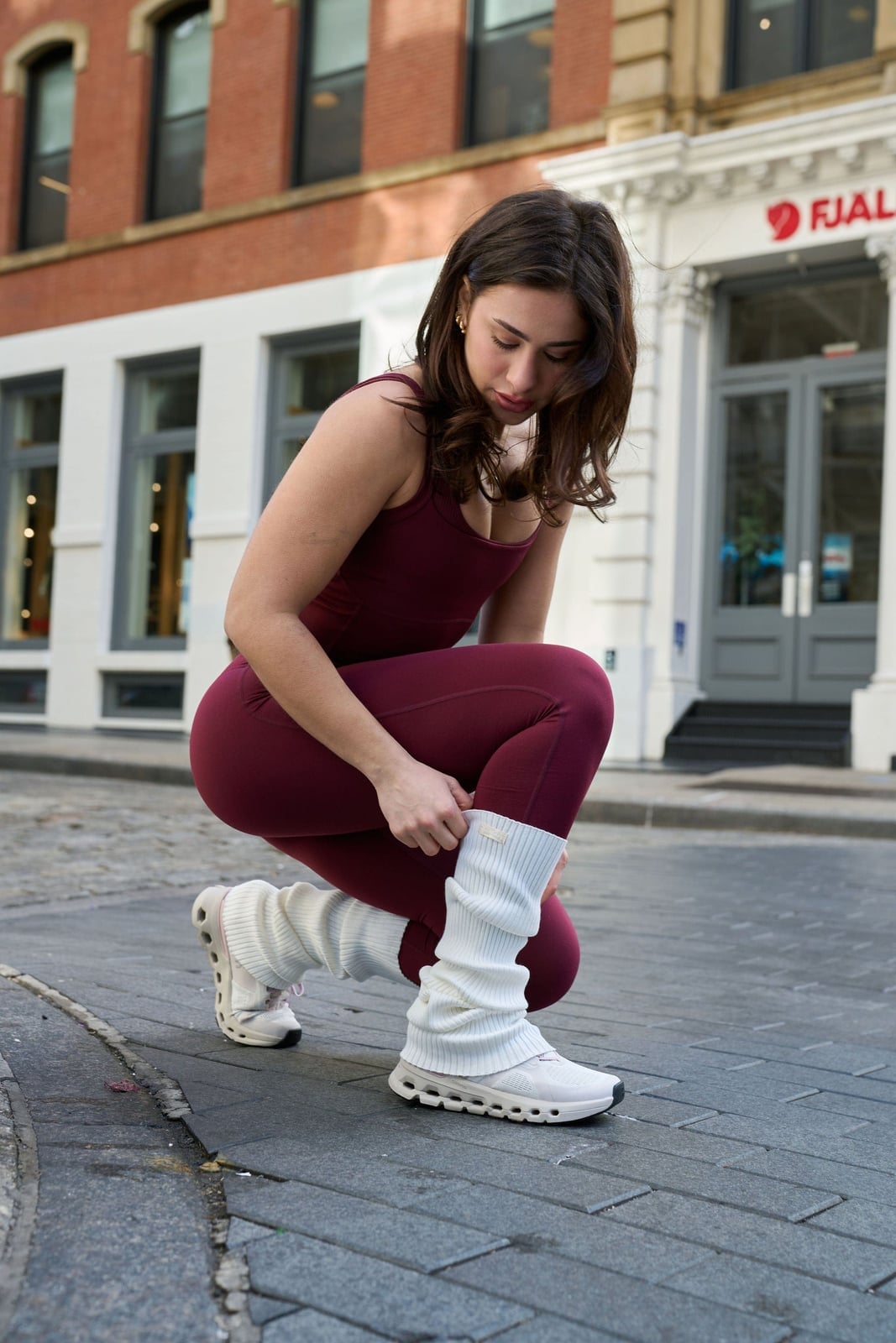 Burgundy Leggings with White Leg Warmers and Sneakers — Classy Leg Warmers Outfits