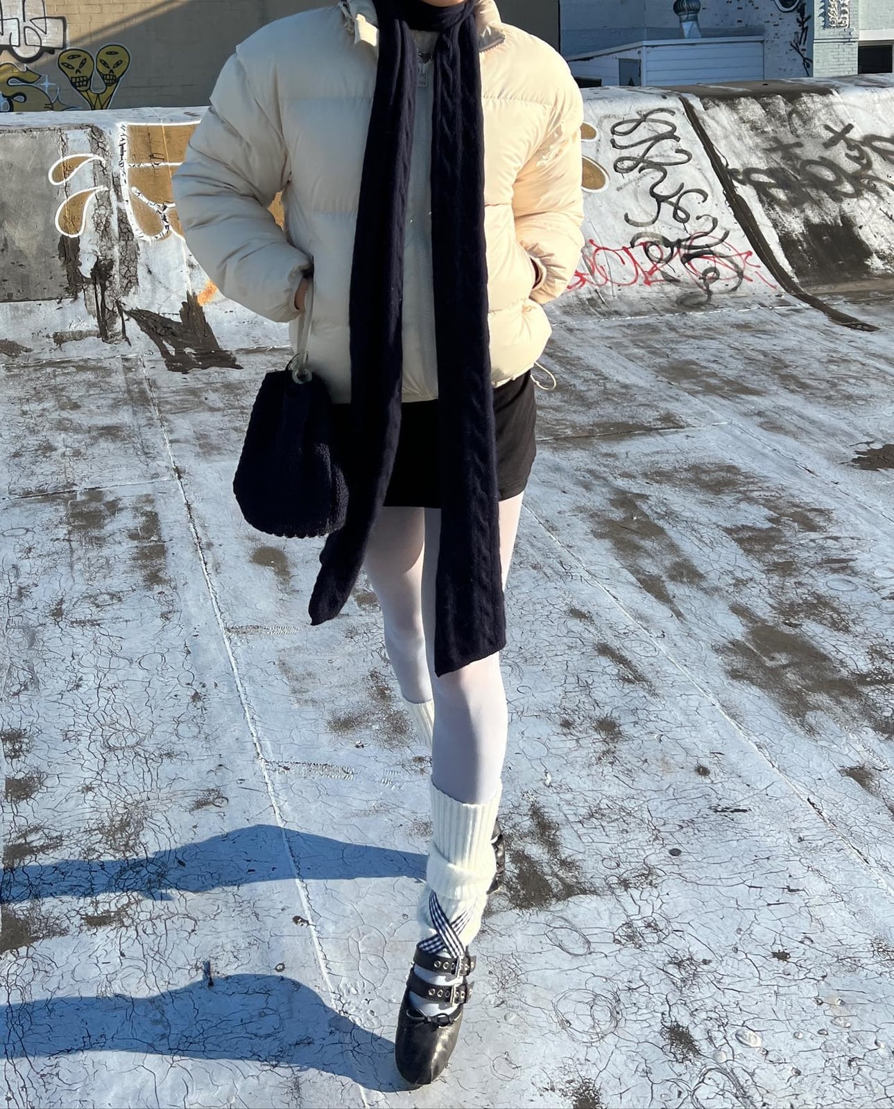 Cream Puffer Jacket with Black Turtleneck and White Leg Warmers — Classy Leg Warmers Outfits