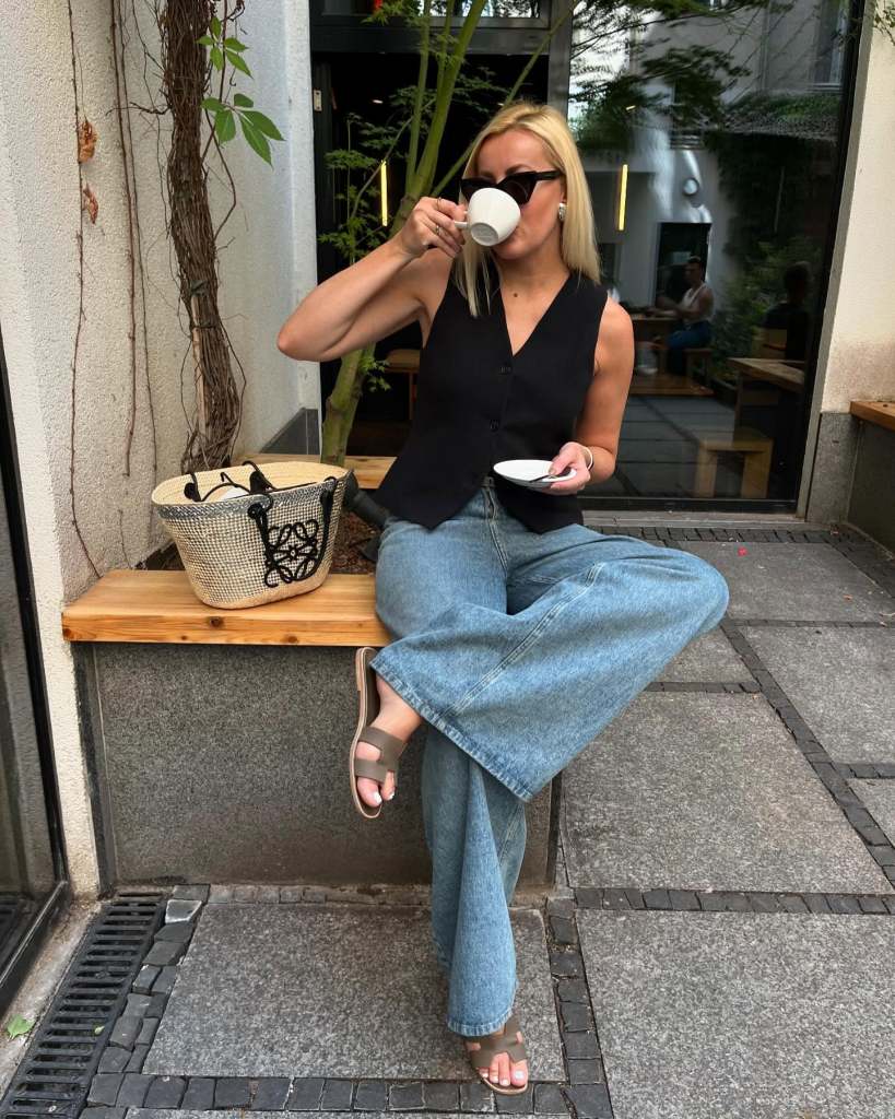 Black Vest and Straw Tote with Light Blue Wide Leg Jeans Black Vest and Straw Tote with Light Blue Wide Leg Jeans — Classy Light Blue Jeans Outfits