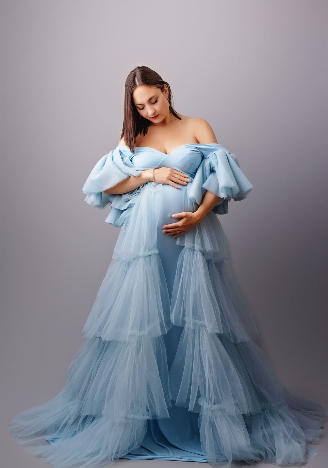 Light Blue Tiered Tulle Gown With Emphasizing The Pregnancy Glow Light Blue Tiered Tulle Gown With Emphasizing The Pregnancy Glow — Classy Maternity Photoshoot Outfits