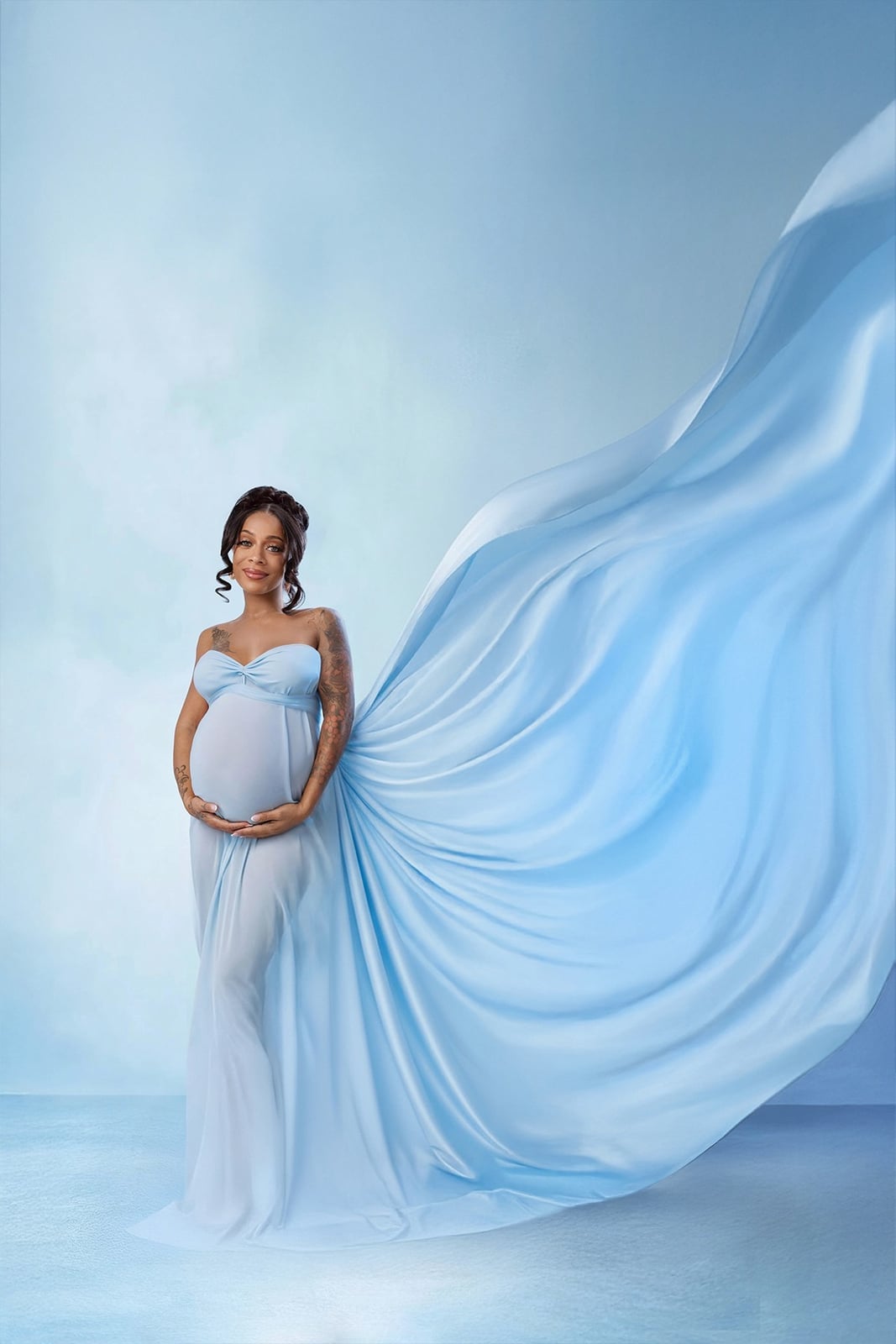 Light Blue Strapless Flowing Gown With Highlighting Her Pregnant Belly Light Blue Strapless Flowing Gown With Highlighting Her Pregnant Belly — Classy Maternity Photoshoot Outfits