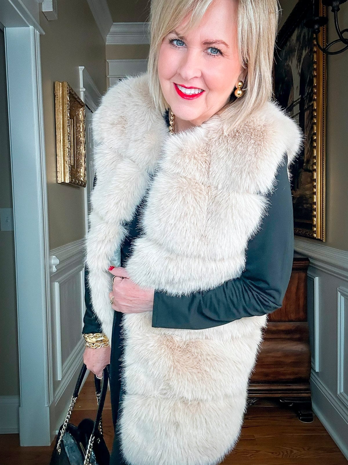 Cream Faux Fur Vest Over Black Top with Gold Jewelry Cream Faux Fur Vest Over Black Top with Gold Jewelry — Classy Mob Wife Outfits