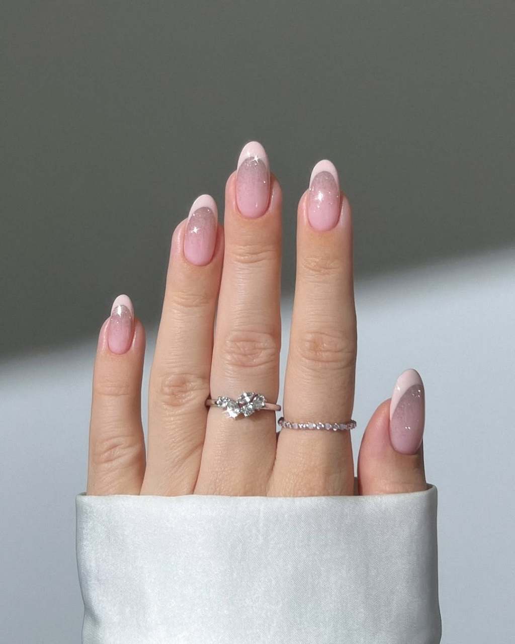 Medium Oval Classic French Ombre With Silver Glitter, Close-Up Take Medium Oval Classic French Ombre With Silver Glitter, Close-Up Take — Classy Ombré Nails