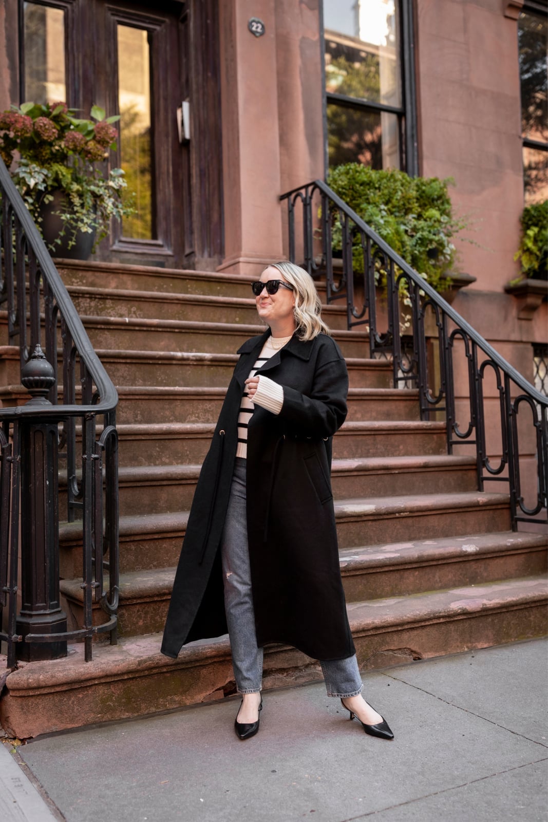 Long Black Coat Over Striped Sweater and Gray Jeans Long Black Coat Over Striped Sweater and Gray Jeans — Classy Outdoor Outfit