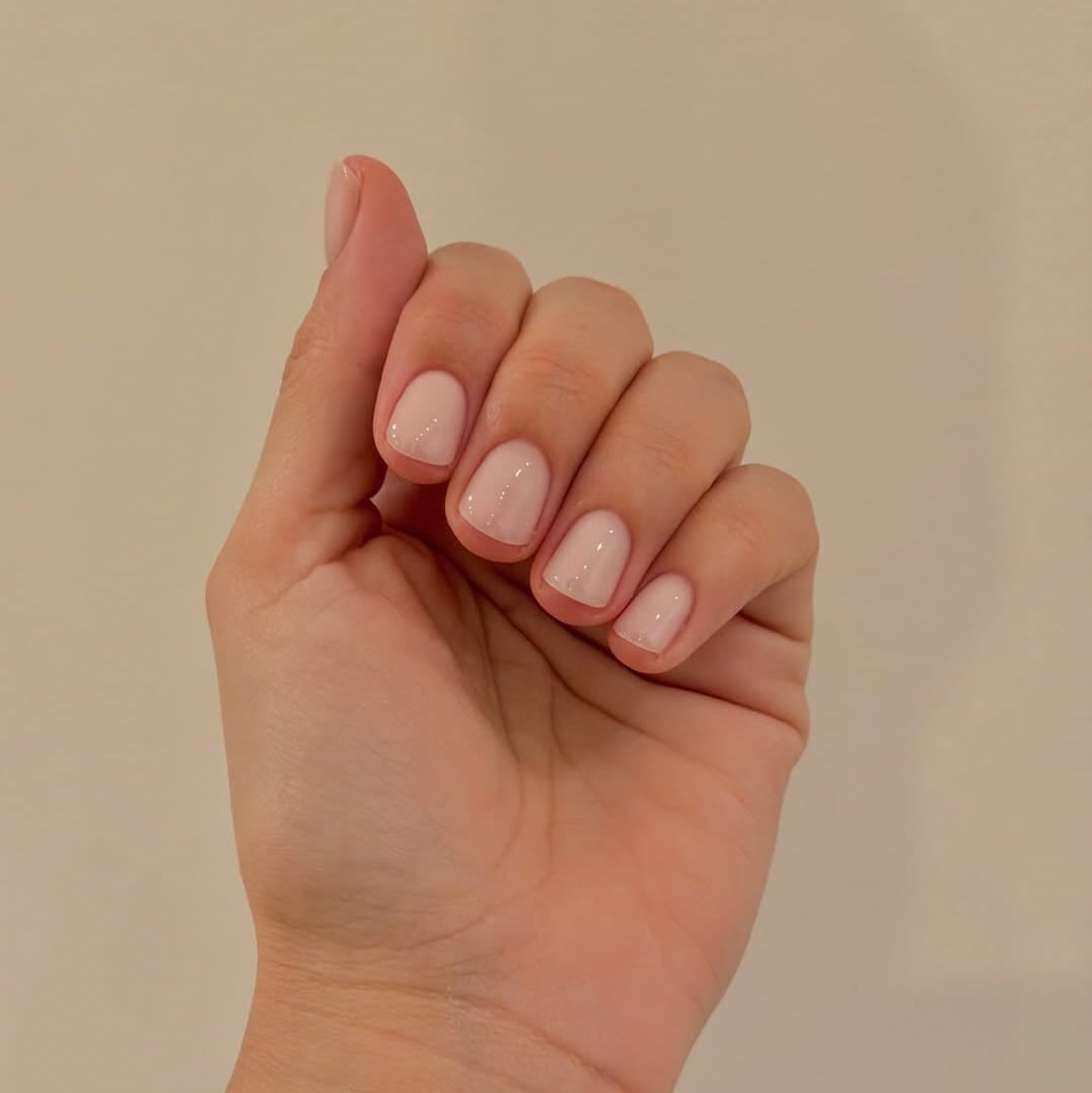 Sheer Milky Pink Glossy Short Oval Nails, Close-Up Take Sheer Milky Pink Glossy Short Oval Nails, Close-Up Take — Classy Plain Nails