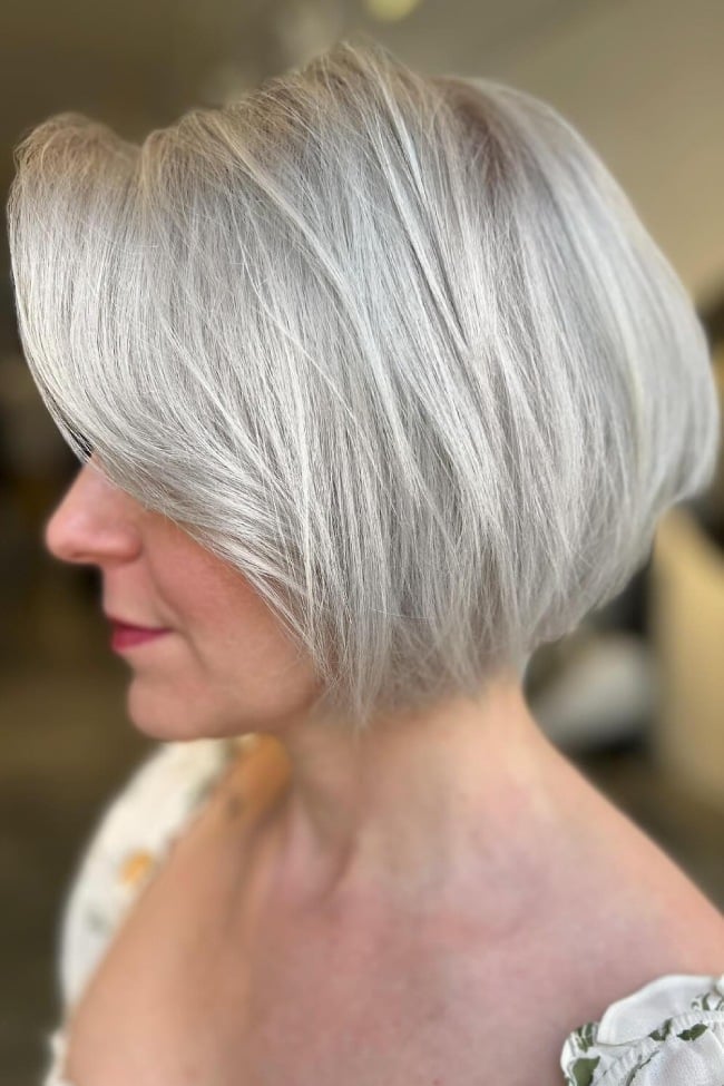 Chin Length Bob With Side-Swept Bangs in Platinum Blonde — Classy Platinum Highlights