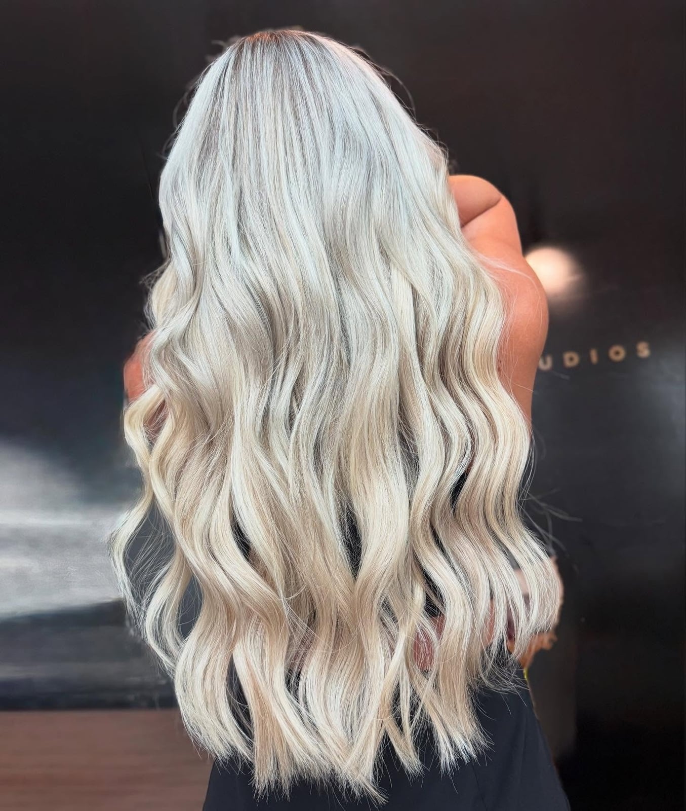Mid-Back Voluminous Waves in Uniform Platinum Blonde — Classy Platinum Highlights