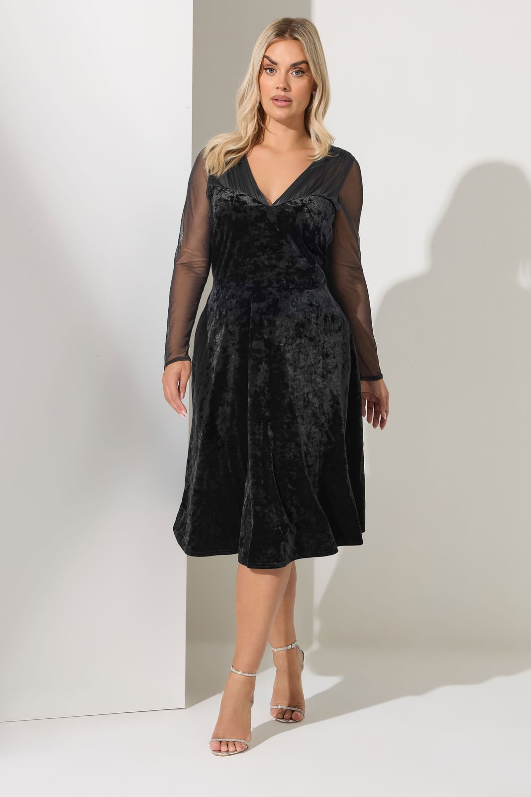 Black Velvet Skater Dress with Mesh Sleeves and Strappy Heeled Sandals Black Velvet Skater Dress with Mesh Sleeves and Strappy Heeled Sandals — Classy Plus Size Dresses