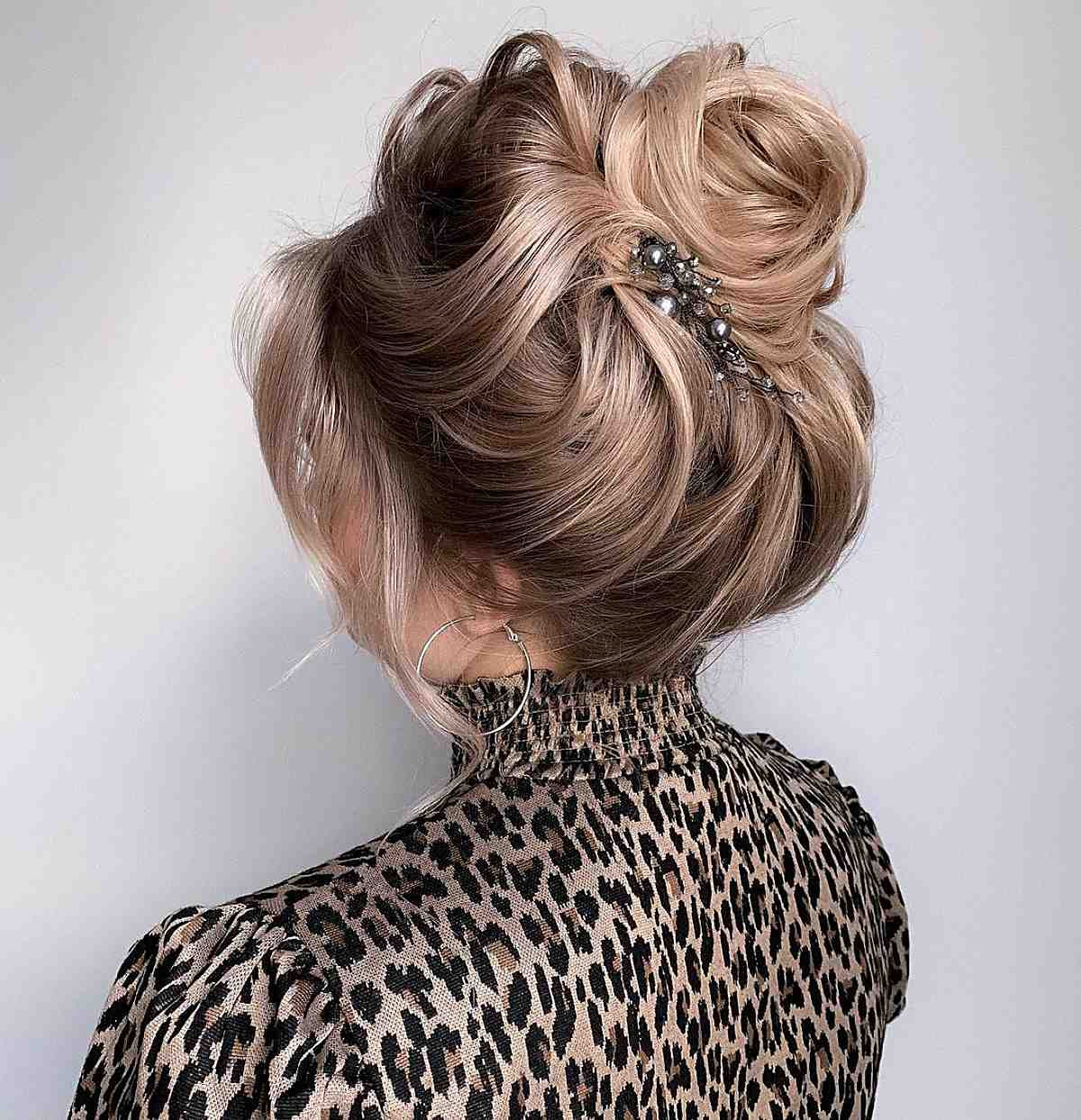 Voluminous Ash Blonde Updo With Wispy Bangs Voluminous Ash Blonde Updo With Wispy Bangs — Classy Puff Hairstyles