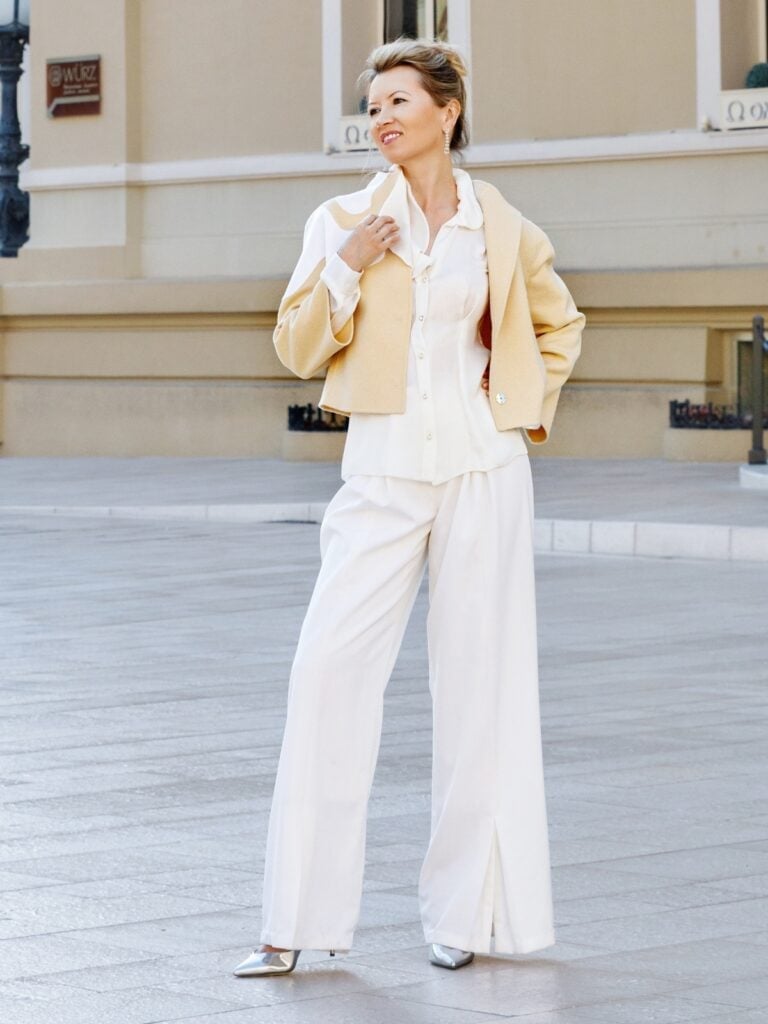 Cream and Pale Yellow Wide-Leg Trousers With She Wears Flowing Cream and Pale Yellow Wide-Leg Trousers With She Wears Flowing — Classy Restaurant Outfit