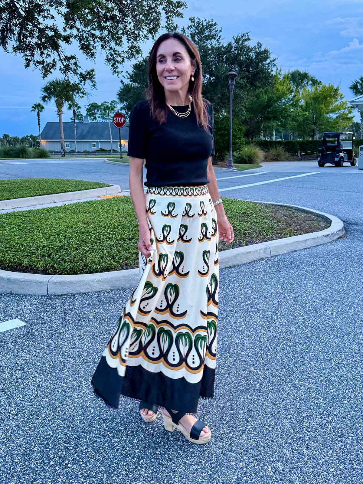 Patterned Maxi Skirt with Black Top Patterned Maxi Skirt with Black Top — Classy Restaurant Outfit