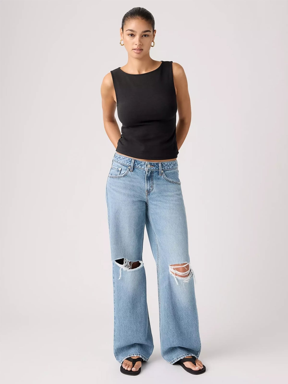 Light Blue Ripped Wide-Leg Jeans with Black Top and Flat Sandals Light Blue Ripped Wide-Leg Jeans with Black Top and Flat Sandals — Classy Ripped Jeans Outfits