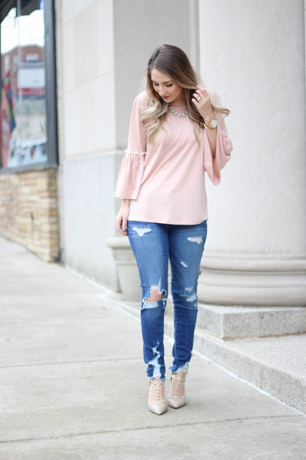 Ripped Blue Jeans with Pink Bell-Sleeve Blouse and Beige Pumps Ripped Blue Jeans with Pink Bell-Sleeve Blouse and Beige Pumps — Classy Ripped Jeans Outfits
