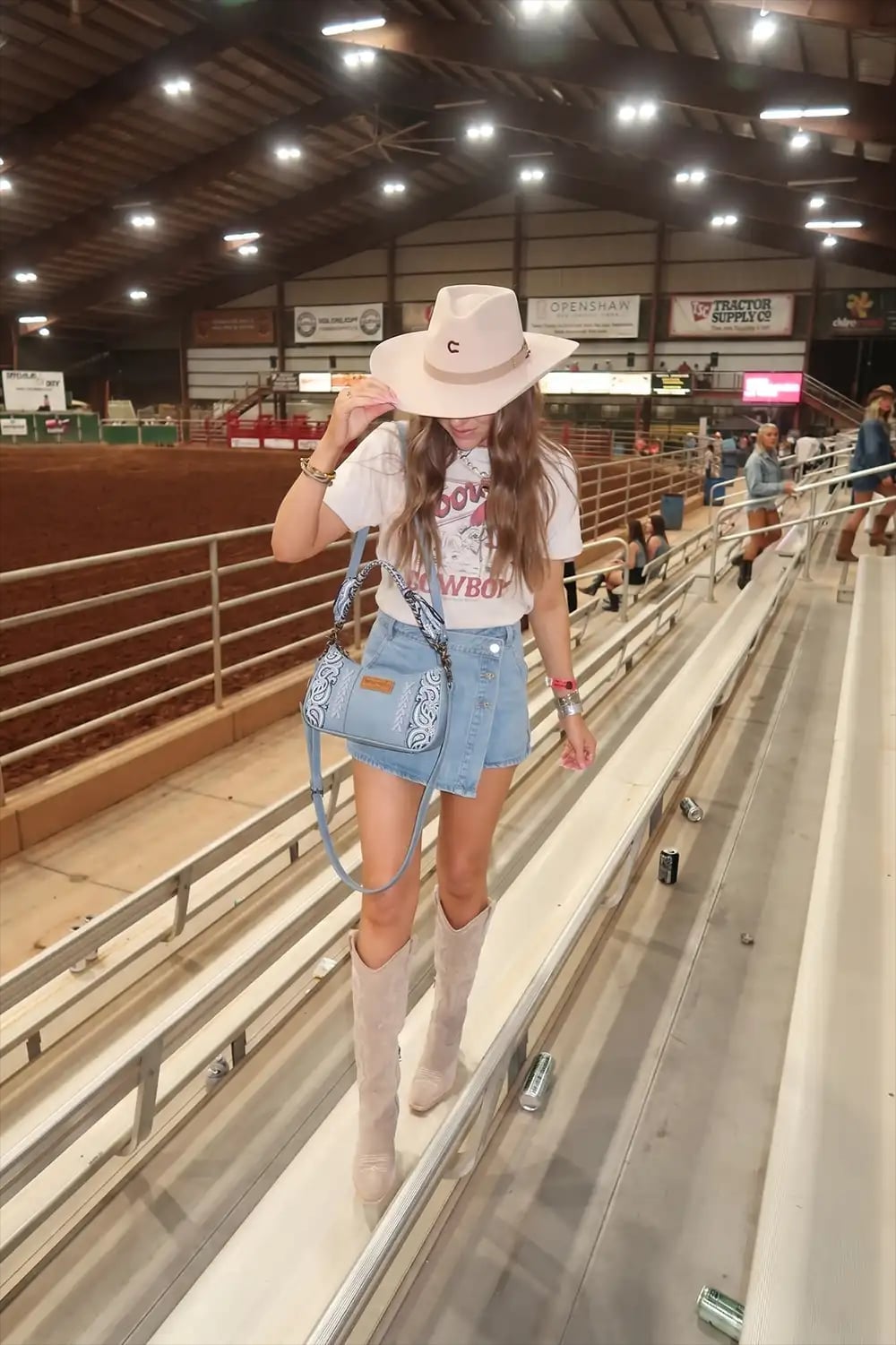 White Graphic T-Shirt with Denim Skort and Suede Cowboy Boots White Graphic T-Shirt with Denim Skort and Suede Cowboy Boots — Classy Rodeo Outfits for Women