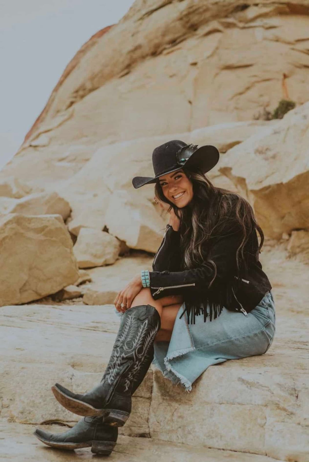 Black Fringed Jacket and Denim Skirt Create a Chic Cowgirl Look Black Fringed Jacket and Denim Skirt Create a Chic Cowgirl Look — Classy Rodeo Outfits for Women