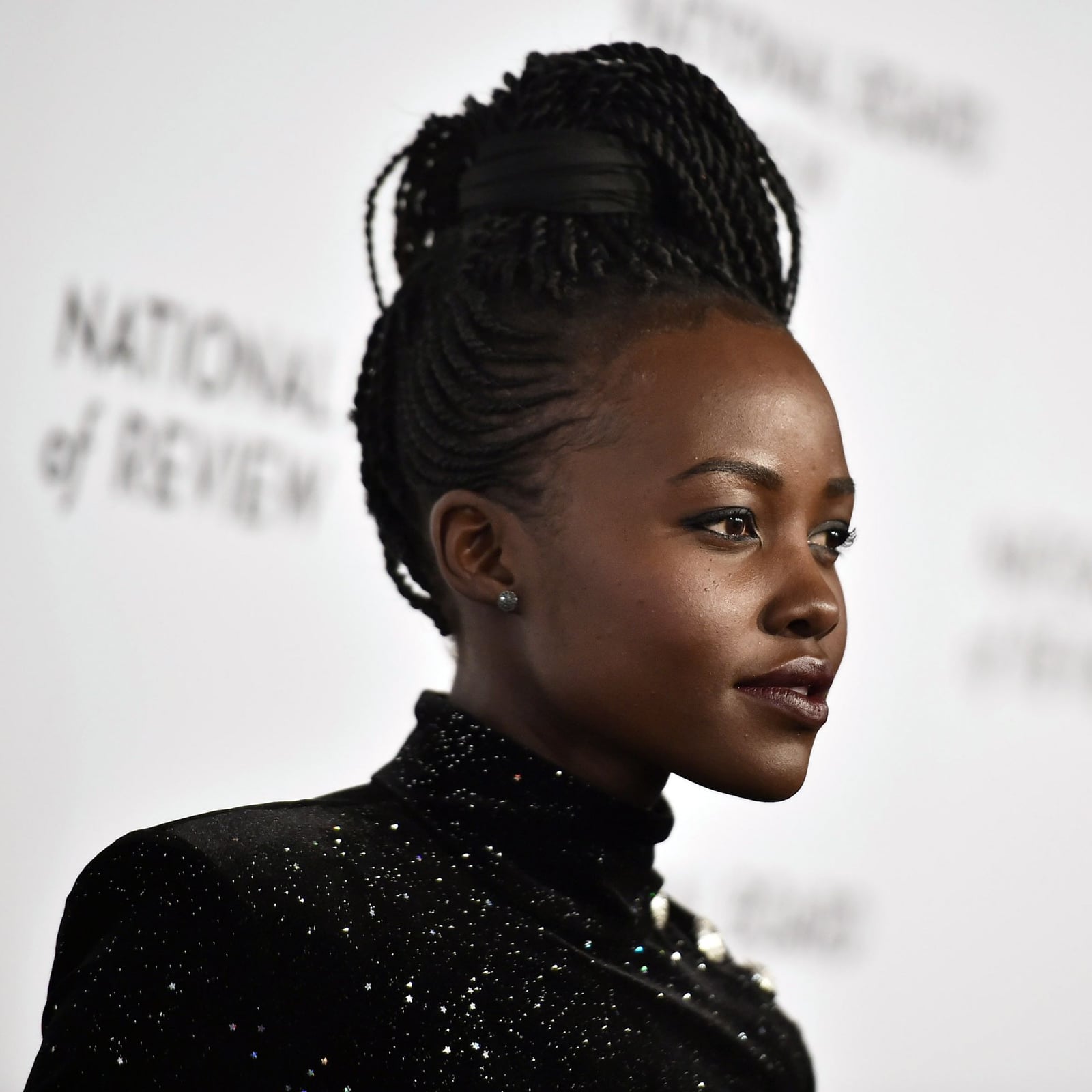 Sleek High Bun With Braided Accents Sleek High Bun With Braided Accents — Classy Senegalese Twists