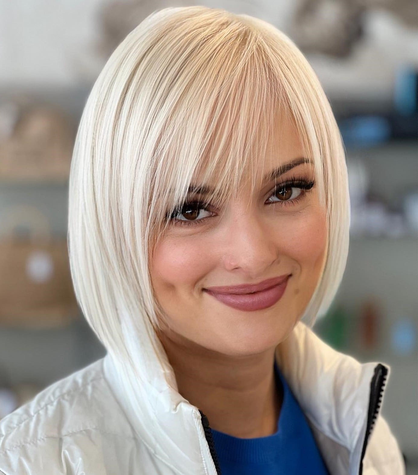 Platinum Blonde Bob With Sleek Side Swept Bangs Platinum Blonde Bob With Sleek Side Swept Bangs — Classy Side Part Bangs