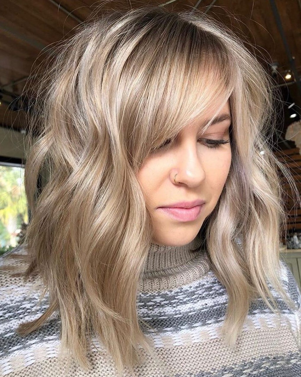 Ash Blonde Layers With Textured Waves Ash Blonde Layers With Textured Waves — Classy Side Part Bangs