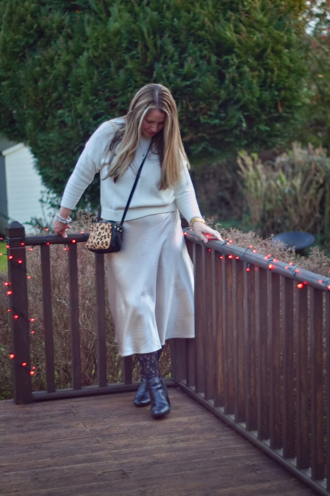 Cream Satin Slip Skirt With Crewneck Sweater and Ankle Boots — Classy Slip Skirt Outfits