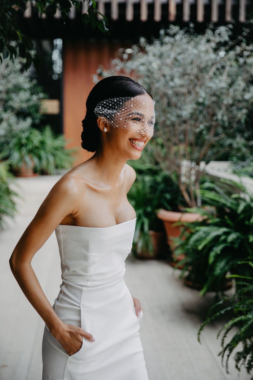 Sleek Low Updo With Birdcage Veil Sleek Low Updo With Birdcage Veil — Classy Strapless Dresses Hairstyles