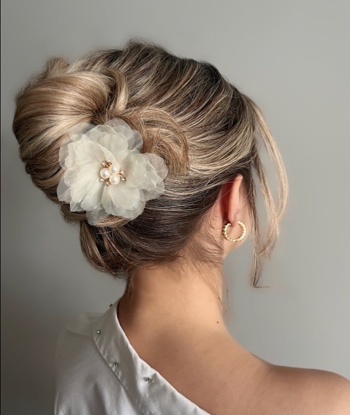 Intricate Blonde Updo With Floral Accessory Intricate Blonde Updo With Floral Accessory — Classy Trending Hairstyle