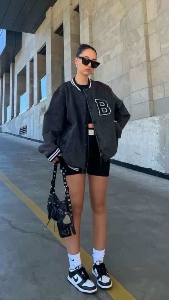 Dark Gray Denim Varsity Jacket with Crop Top and Biker Shorts — Classy Varsity Jacket Outfits