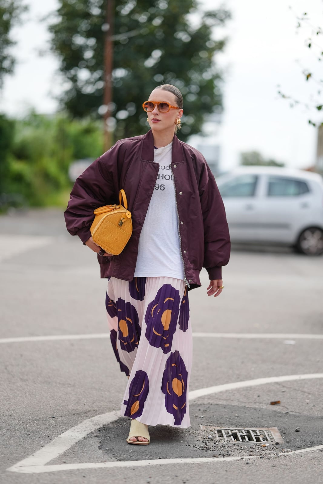 Burgundy Bomber Jacket with Graphic T-Shirt and Floral Skirt — Classy Varsity Jacket Outfits