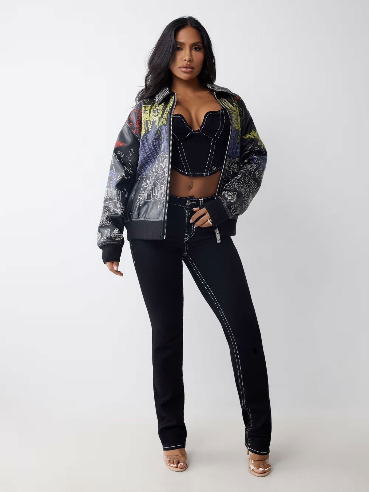Graphic Print Jacket with Corset Top and Straight-Leg Jeans — Classy Varsity Jacket Outfits